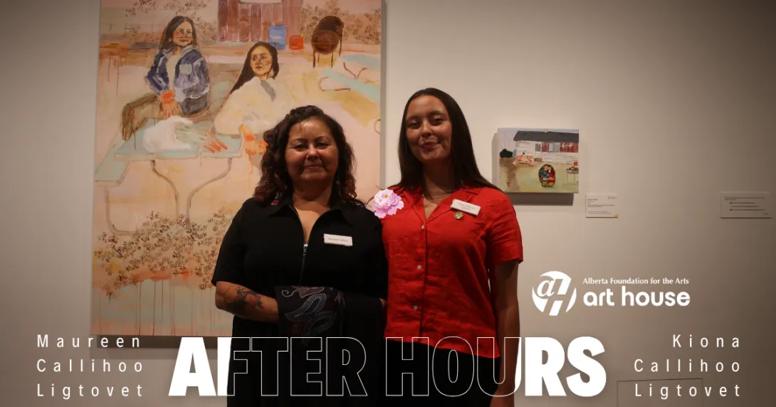 Maureen Callihoo and Kiona Callihoo Ligtvoet stand together in front of their artworks. Maureen is wearing a black shirt while Kiona is wearing a red shirt.